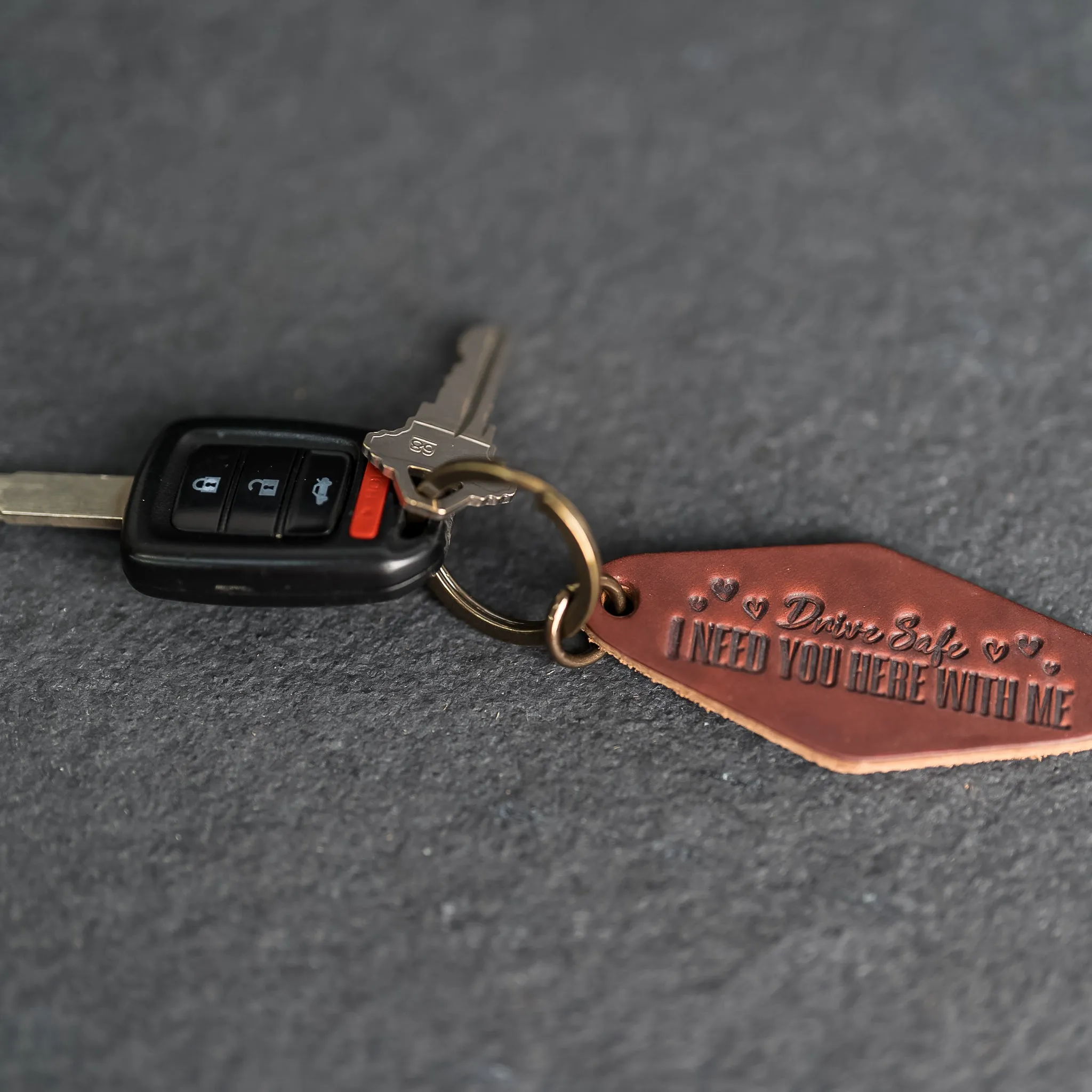 Leather Motel Key Shape Keychain with a Drive Safe Stamp Design