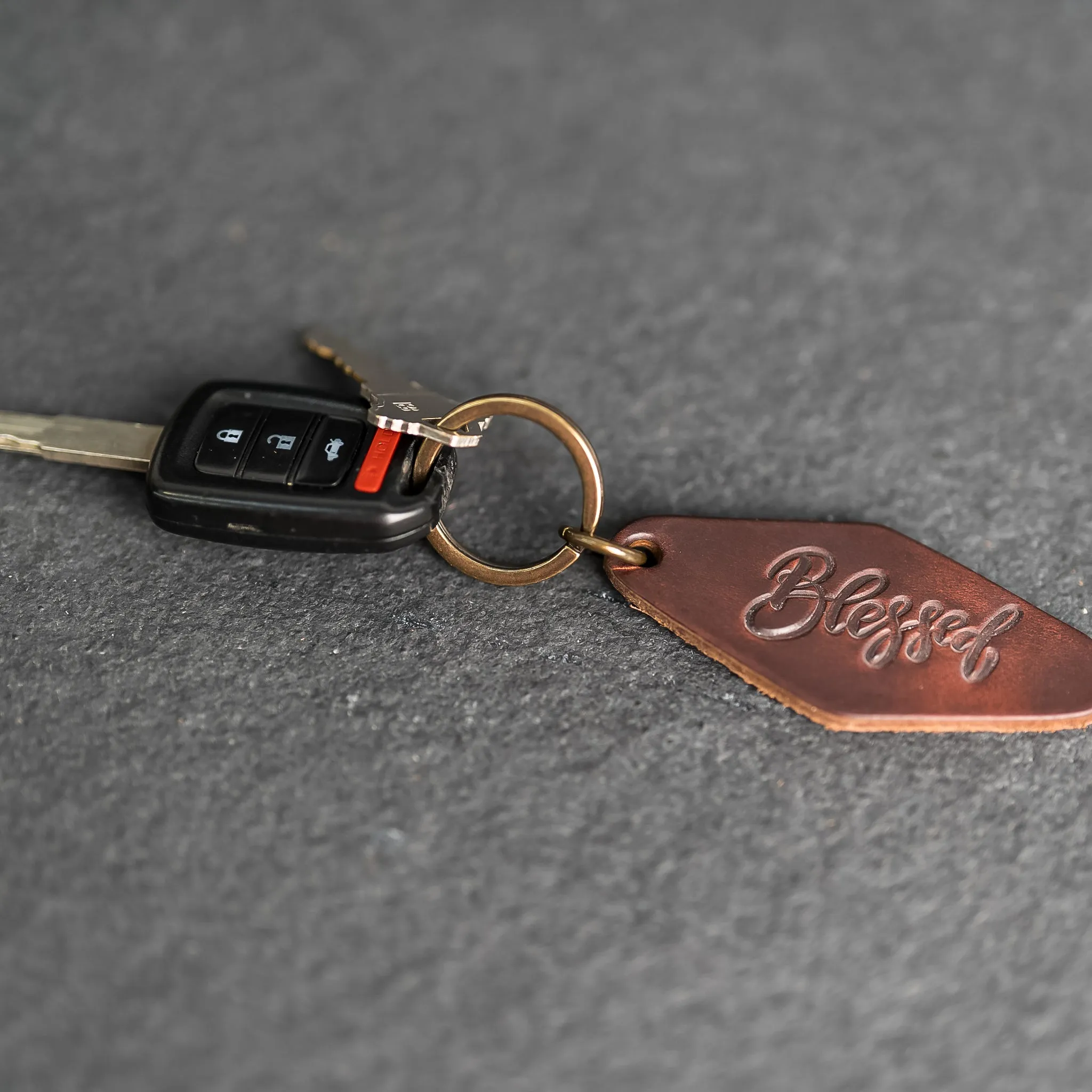 Leather Motel Key Shape Keychain with a Drive Safe Stamp Design